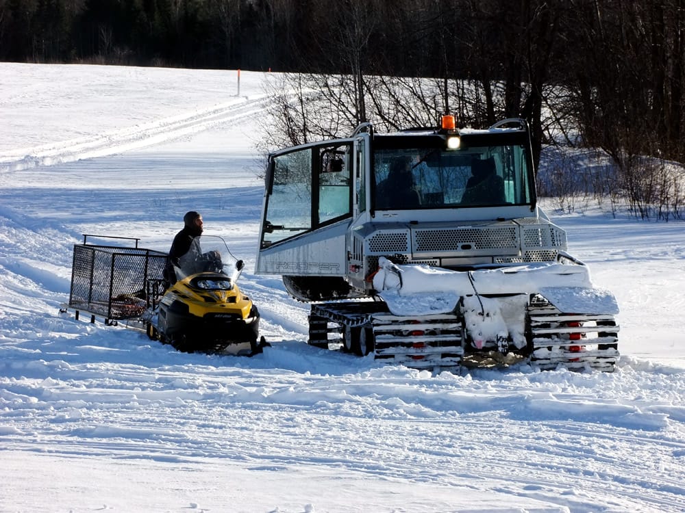 maine snow sled groomer winter weather photo