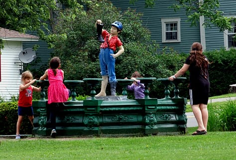 boy n the boot statue photo