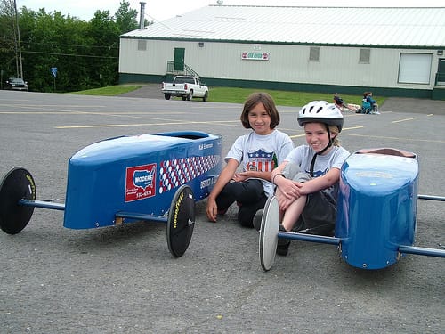 Waiting to soap box derby race in the next heat to determine the winner.